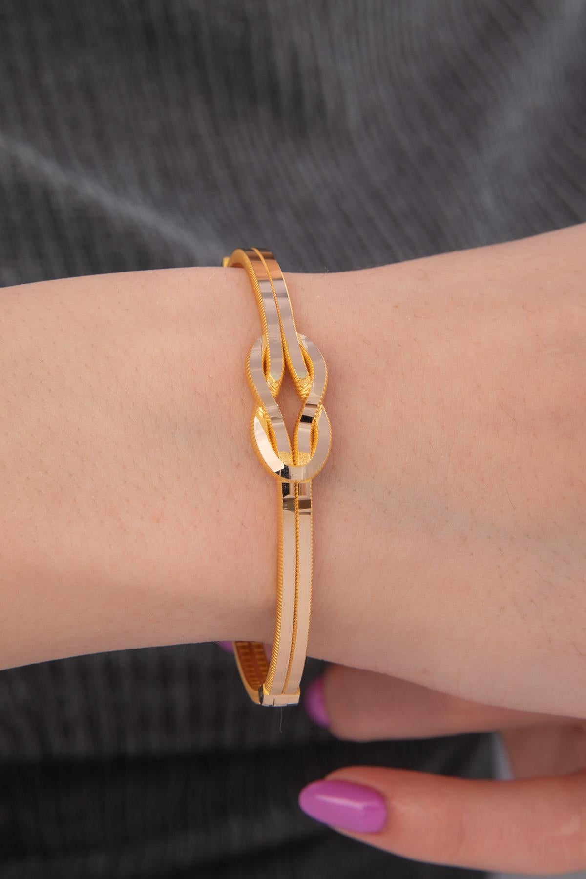 14 K Gold Gleaming Two Tone Love Knot Bangle