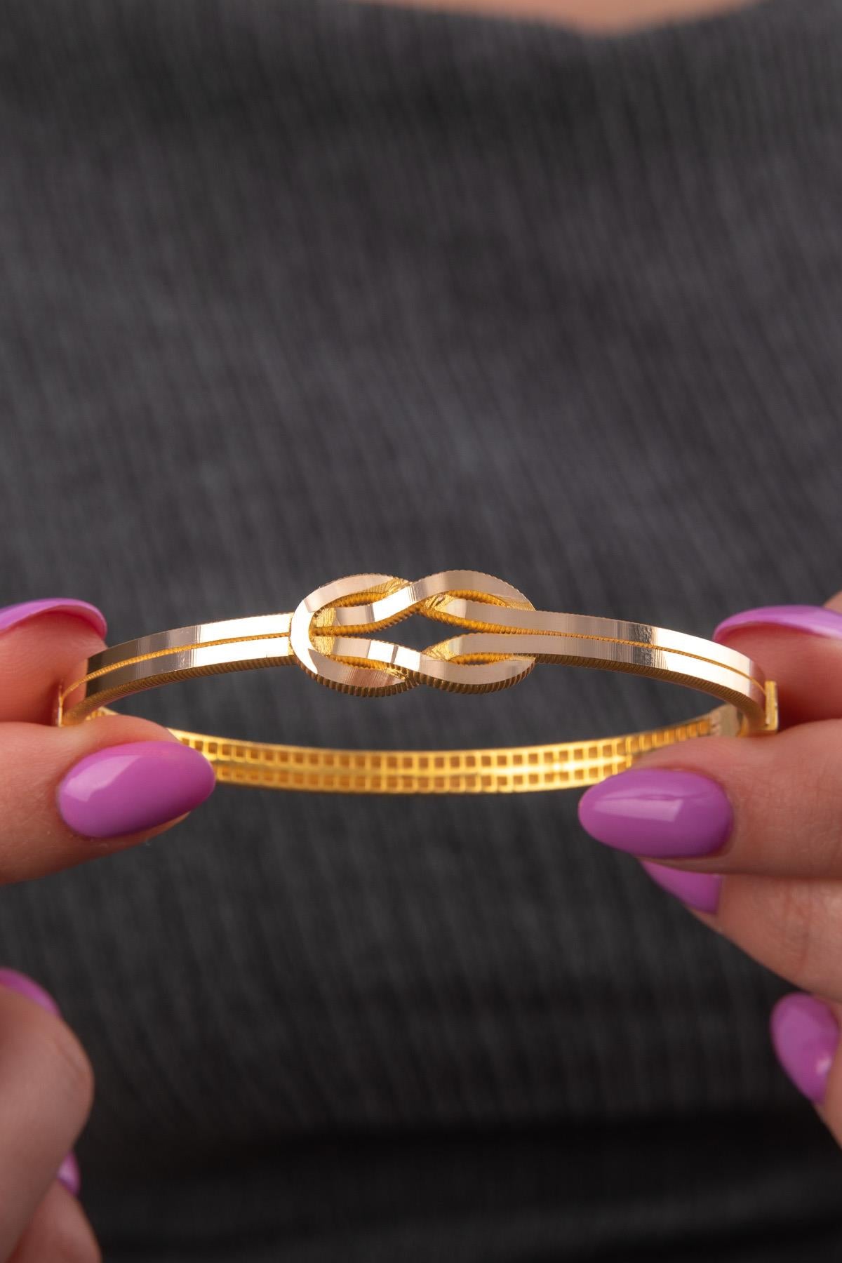 14 K Gold Gleaming Two Tone Love Knot Bangle