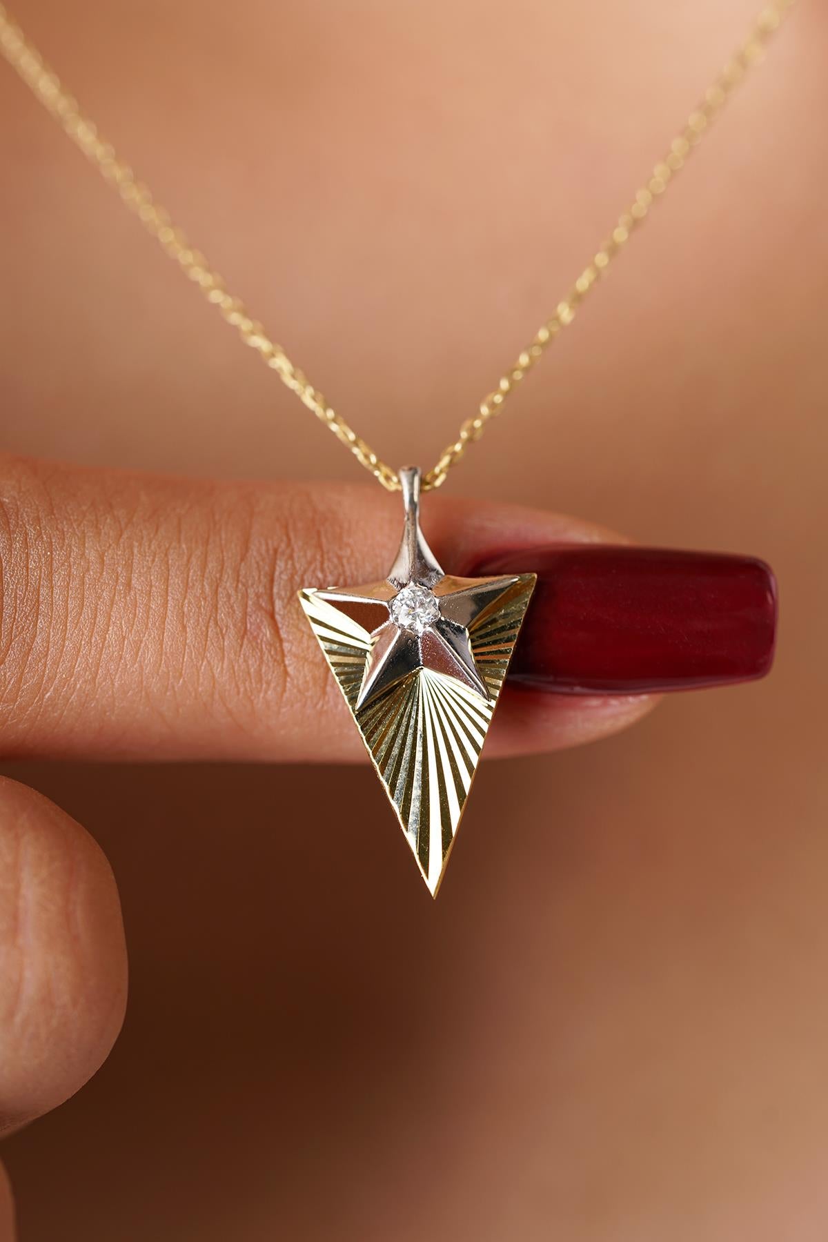 14K Gold Sparkling Star Necklace with Solitaire Detail